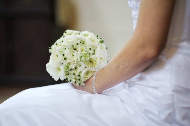 Bride holding beautiful wedding flowers bouquet royalty free stock photo Bride holding beautiful wedding flowers bouquet royalty free stock photo
