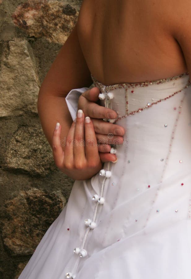 Bride holding grooms hand