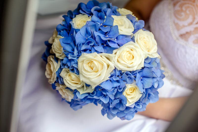 The Bride Holds a Wedding Bouquet in Her Hands. Bouquet of White and