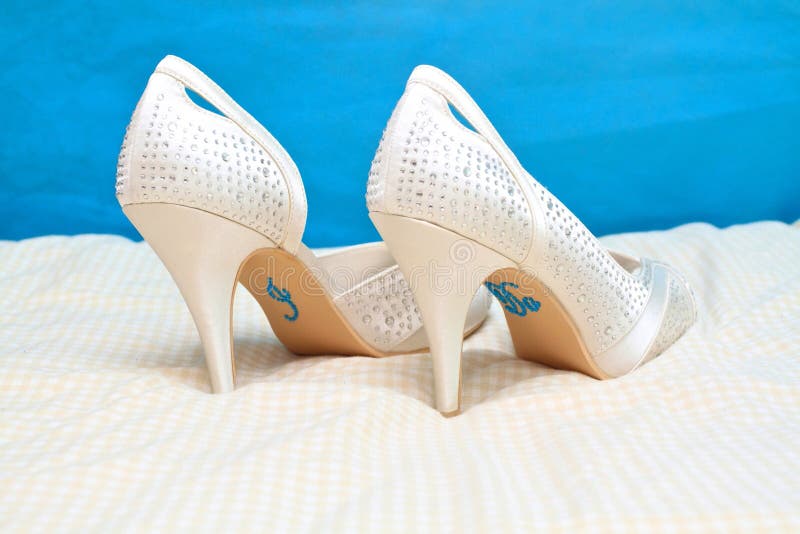 Bridal Wedding Shoes With I Do Message On Sole Isolated On White  Background. Marriage Concept Stock Photo, Picture and Royalty Free Image.  Image 26818048.