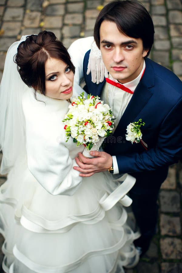 Bride looks confident standing behind a groom royalty free stock image Bride looks confident standing behind a groom royalty free stock image