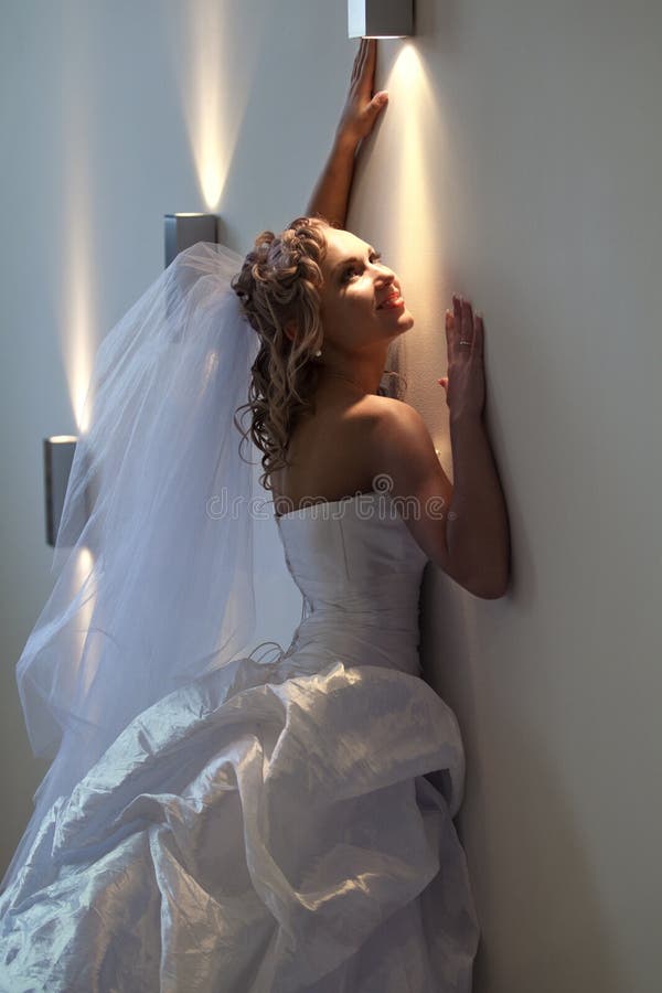 Bride next to the wall