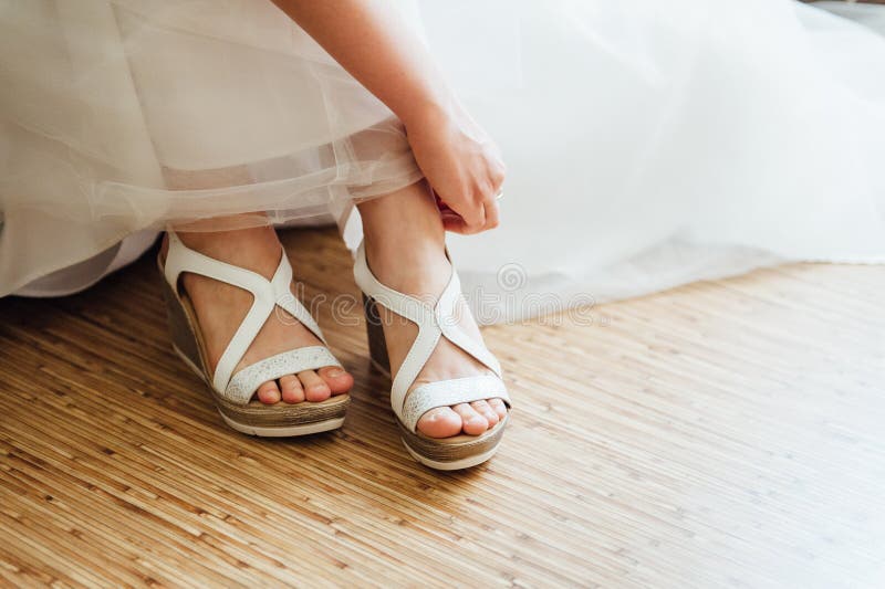 The Bride Puts on White Shoes on Feet Stock Image - Image of family ...