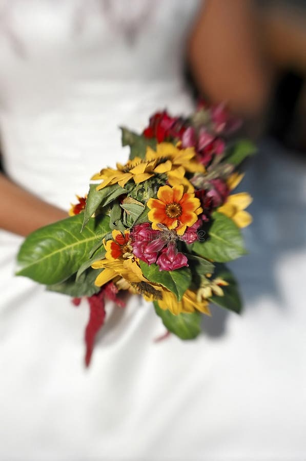 Bride holding wedding bouquet at wedding. Bride holding wedding bouquet at wedding