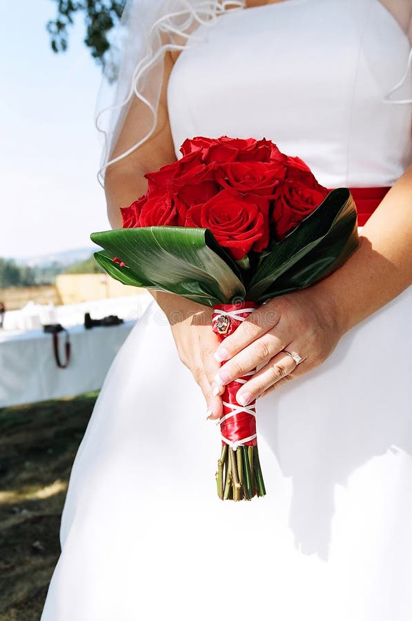 Bride holding wedding bouquet at wedding. Bride holding wedding bouquet at wedding