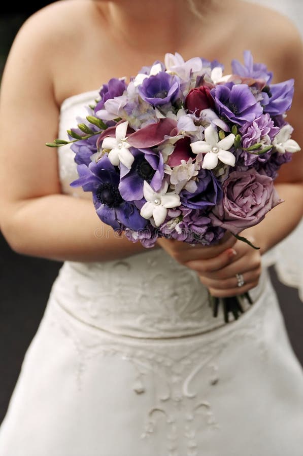 Bride holding wedding bouquet at wedding. Bride holding wedding bouquet at wedding