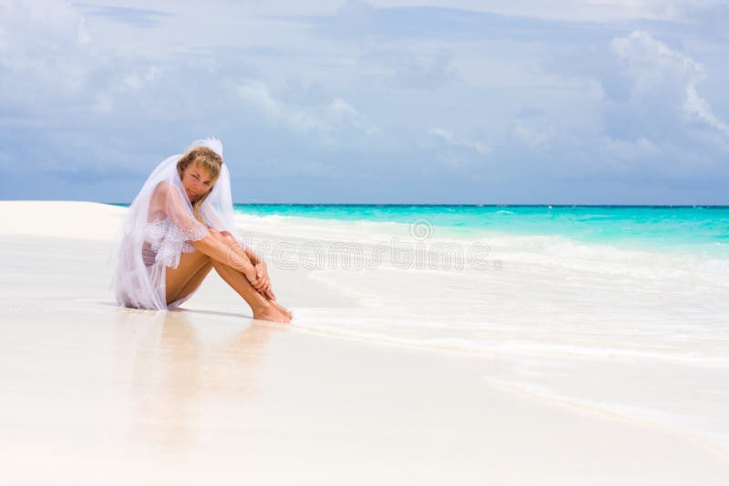 Bride on a tropical beach stock photos