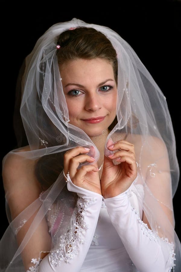 The bride under a veil.