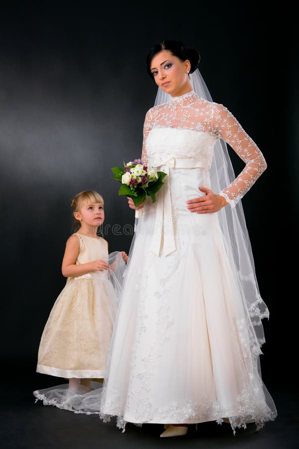 Bride with young bridesmaid royalty free stock image