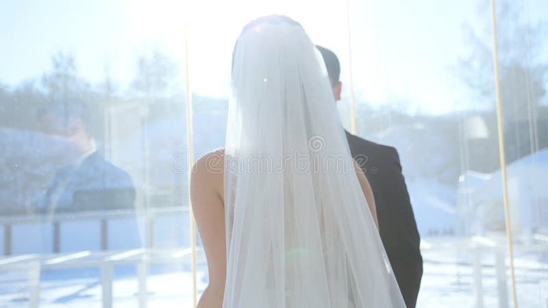 Brides at the window terrace