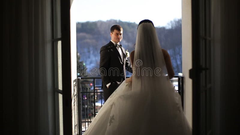 Brides at the window terrace