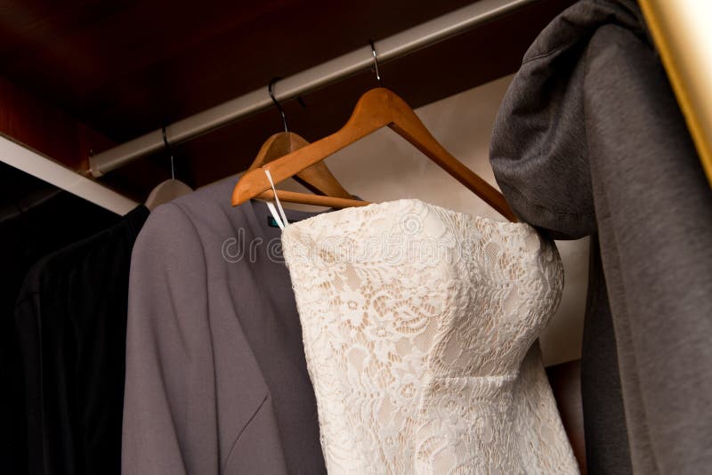 Bridesmaid Dress Hanging in a Closet among Casual Clothes Stock Image ...