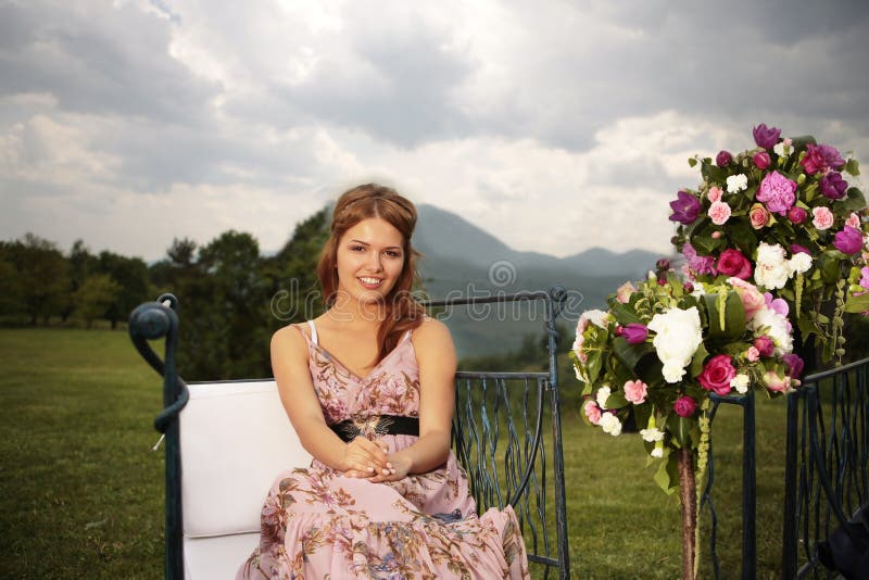 Bridesmaid and flower bouquets in nature