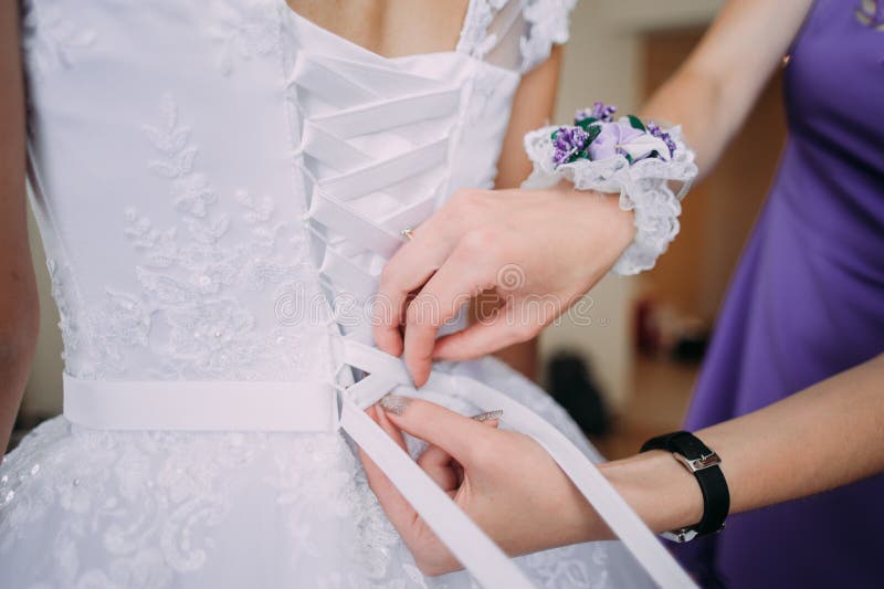 Bridesmaid Tying Bow on Wedding Dress Stock Photo Image of ceremony