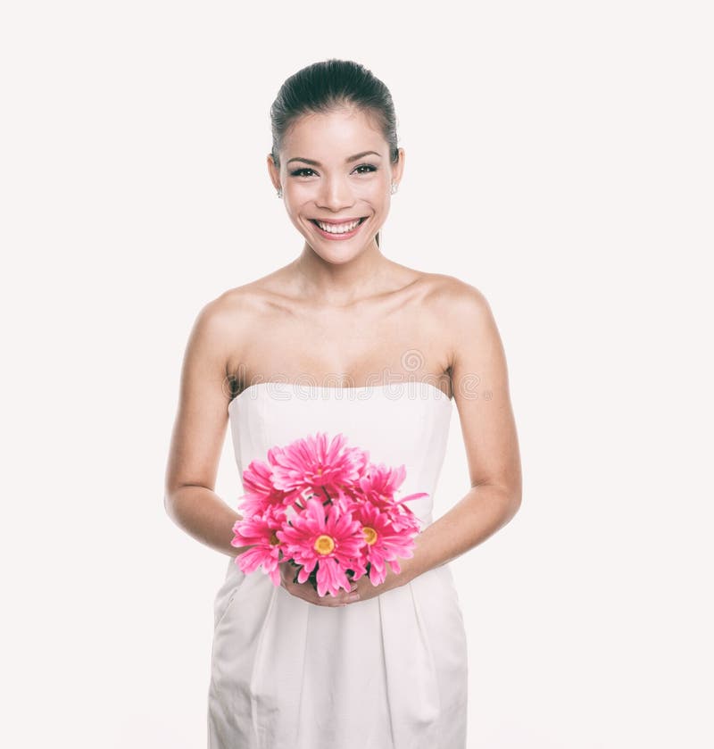 Bridesmaid wedding dress girl with flower bouquet. Asian woman beauty in studio. Maid of honor or bride getting married royalty free stock photo Bridesmaid wedding dress girl with flower bouquet. Asian woman beauty in studio. Maid of honor or bride getting married royalty free stock photo