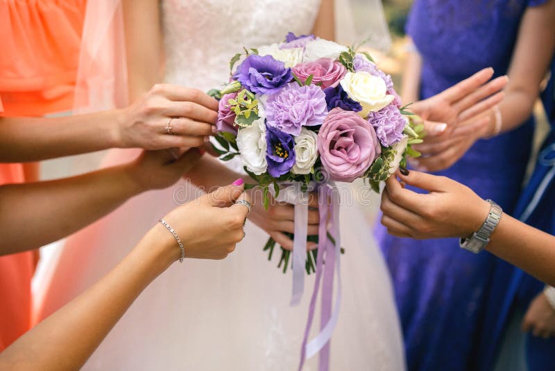 Bridesmaids holding a wedding bouquet royalty free stock photo Bridesmaids holding a wedding bouquet royalty free stock photo