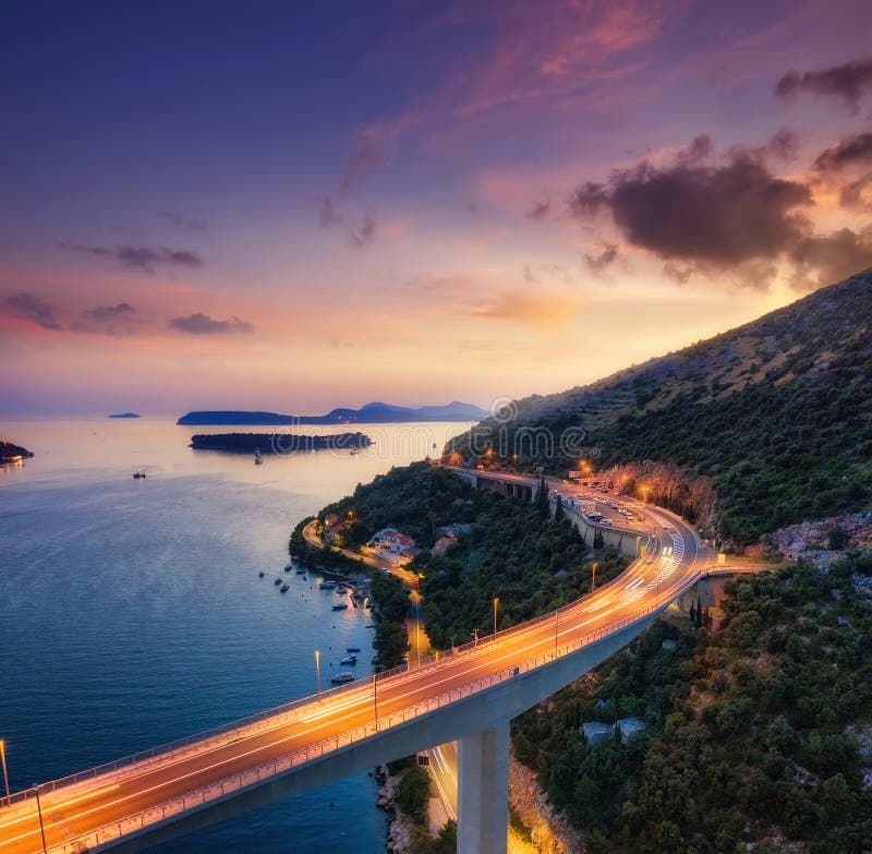 Bridge along the sea shore during sunset. Aerial landscape. View from drone. Evening landscape with architecture. Dubrovnik, Croat