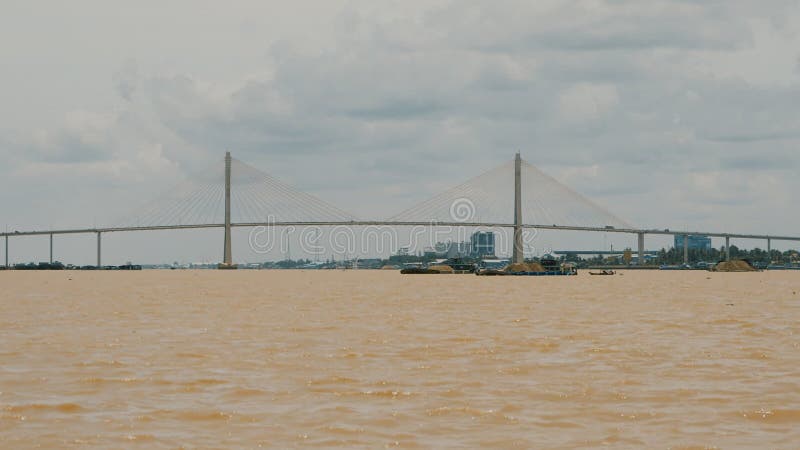 Bridge on the broad Mekong River. Shooting on the move. Vietnam.