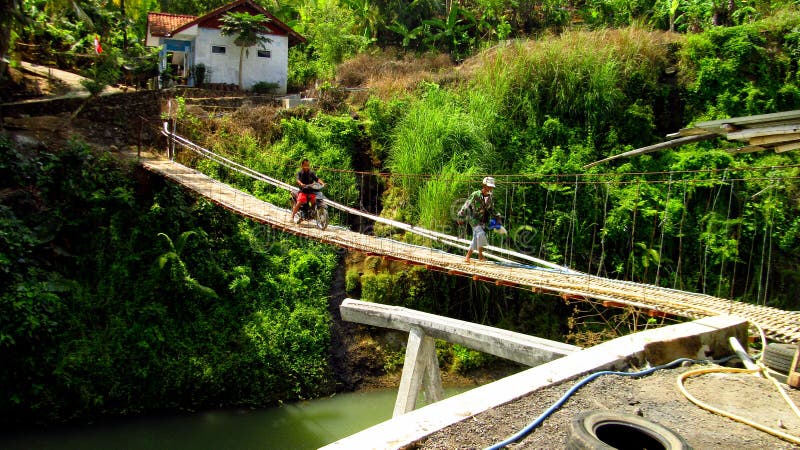 A bridge located in Kampung Kosambi, Subdistric Karangjaya, Tasikmalaya Regency West Java, usually this bridge is used by residents` activities in transporting their garden produce. A bridge located in Kampung Kosambi, Subdistric Karangjaya, Tasikmalaya Regency West Java, usually this bridge is used by residents` activities in transporting their garden produce