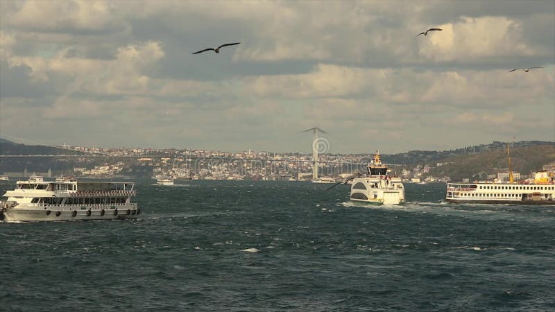 Bridge over the Bosphorus, beautiful clouds and pleasure boats stock footage