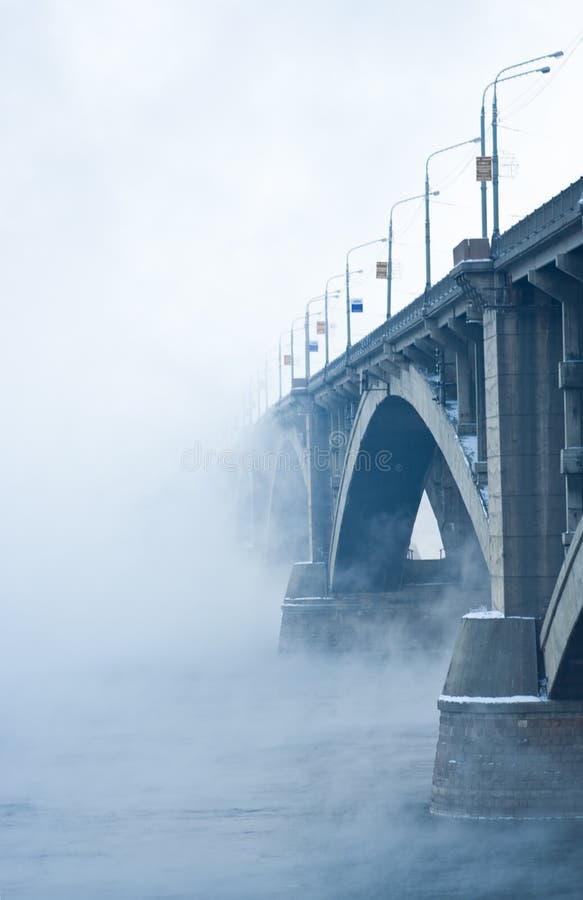 Bridge on river in cold steam