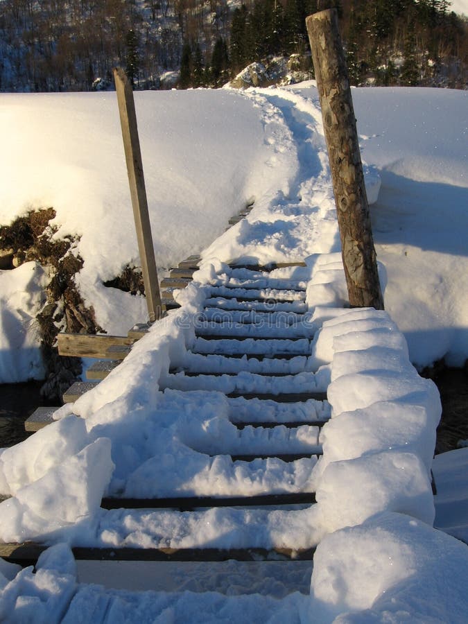 Bridge over river ander snow in caucasus mountains. Bridge over river ander snow in caucasus mountains