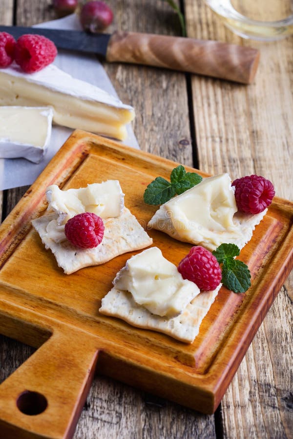 Brie Cheese with Fresh Raspberries and Crackers Stock Image Image of