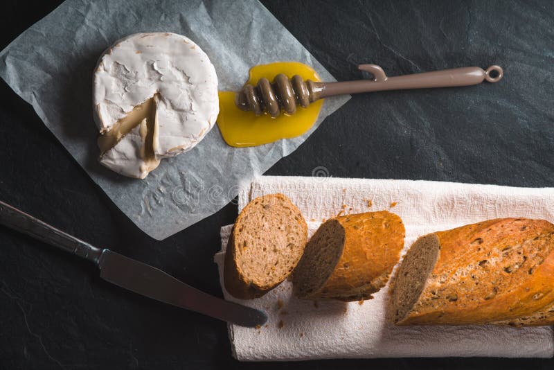 Brie Cheese, Pieces of Baguette, Honey on Parchment Stock Photo Image of noble, gourmet 90452824