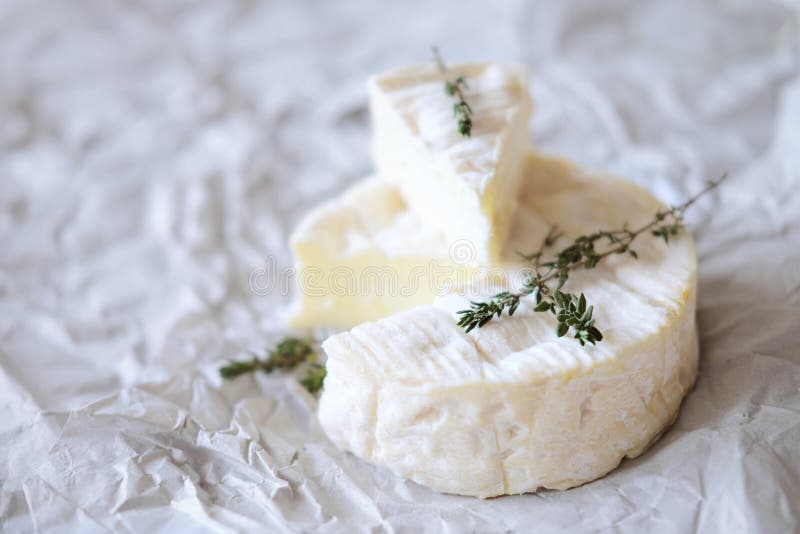 Brie Cheese on Wrapping Paper with Thyme Herbs Stock Image Image of