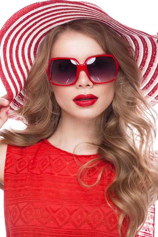 Bright cheerful girl in summer hat, colorful make-up, curls and pink manicure. Beauty face.