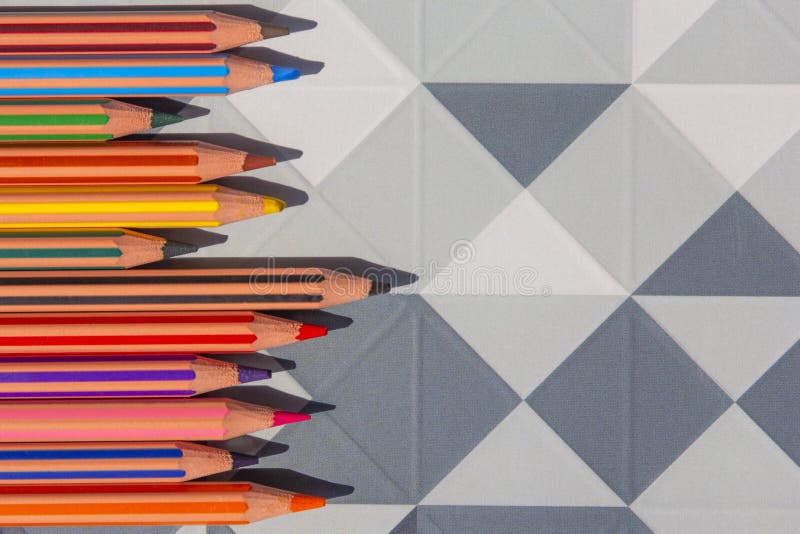 Bright color pencils on modern low poly, polygon geometric abstract background stock photos Bright color pencils on modern low poly, polygon geometric abstract background stock photos