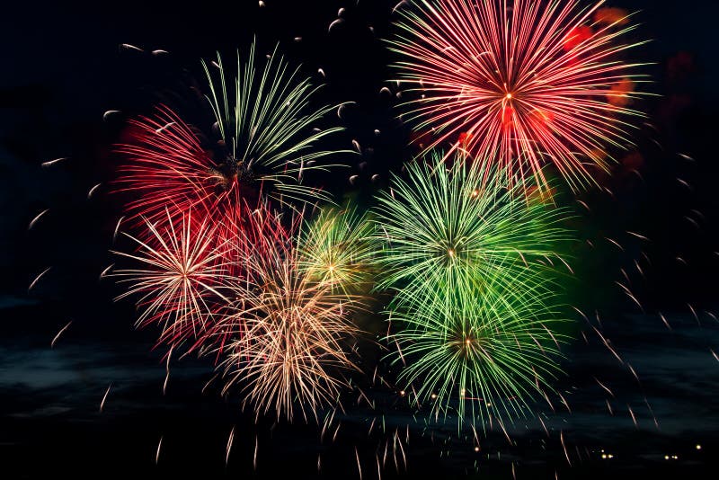 Bright colored fireworks on black background. Celebration and holidays concept. New Year, Independence Day, July 4 Festival. Bright colored fireworks on a black