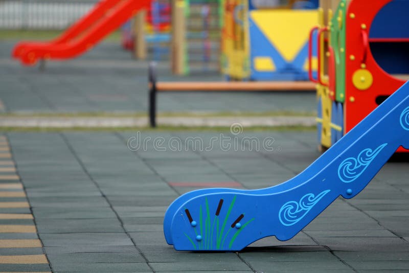 Bright Colorful Slides On Nursery Playground With Soft Rubber