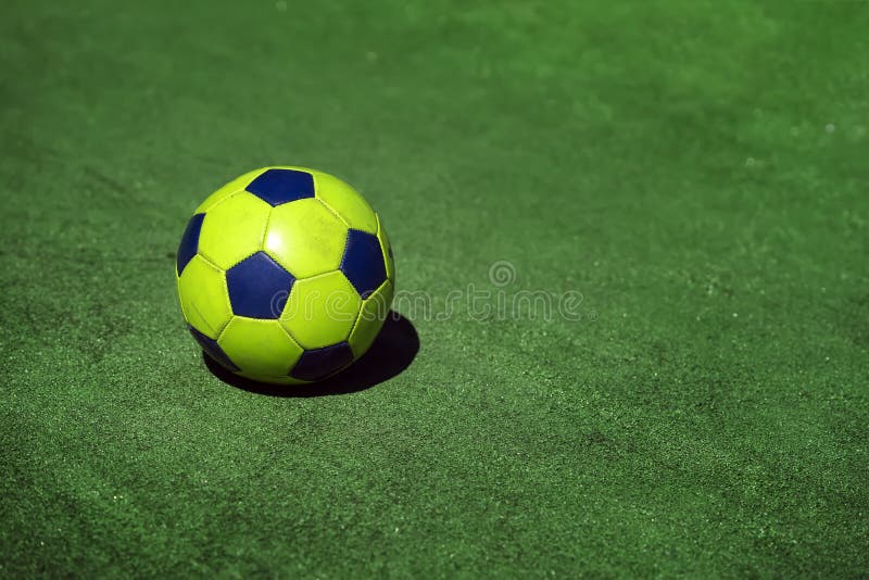 Bright colorful soccer ball on background of green grass of stadium training, playground, copy space, sport modern stock photography Bright colorful soccer ball on background of green grass of stadium training, playground, copy space, sport modern stock photography