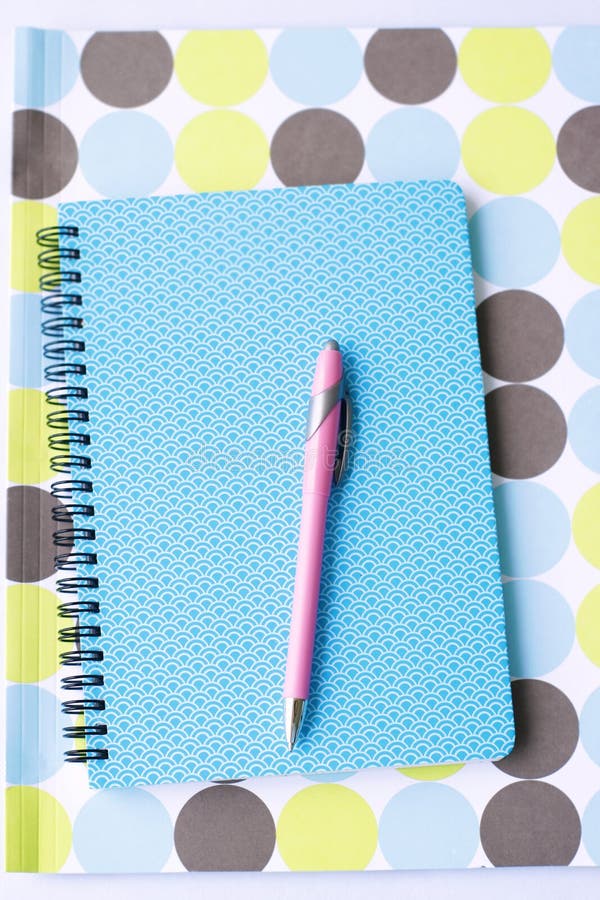 Bright coloured stationery and pen