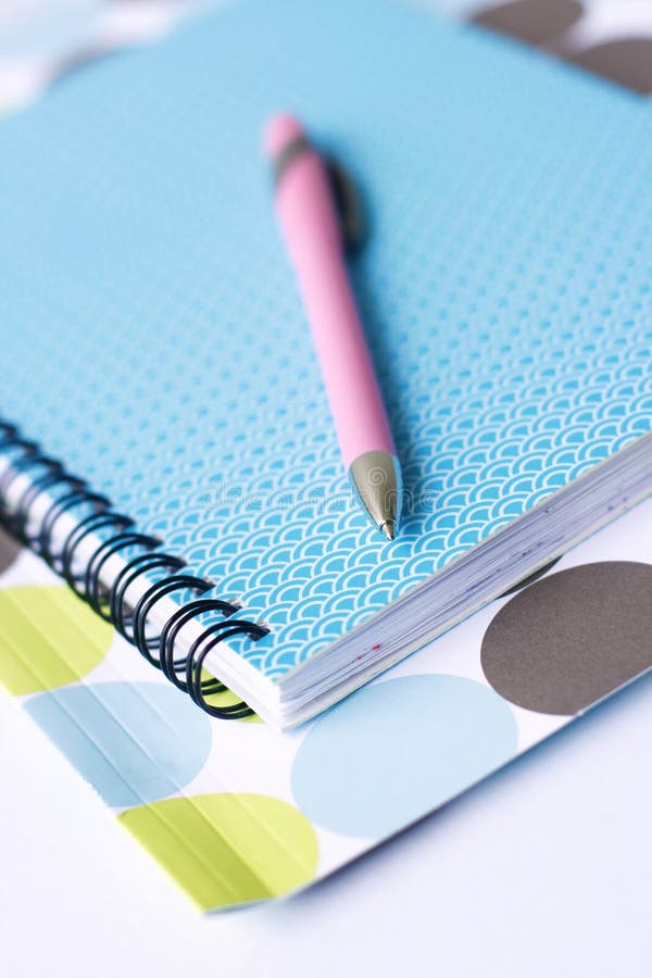 Bright coloured stationery and pen