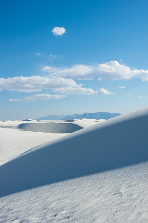 A bright day with white clouds and dunes stock image A bright day with white clouds and dunes stock image