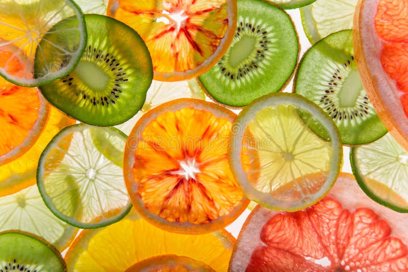 Bright fresh citrus slices, back light transparent fruit. royalty free stock photos
