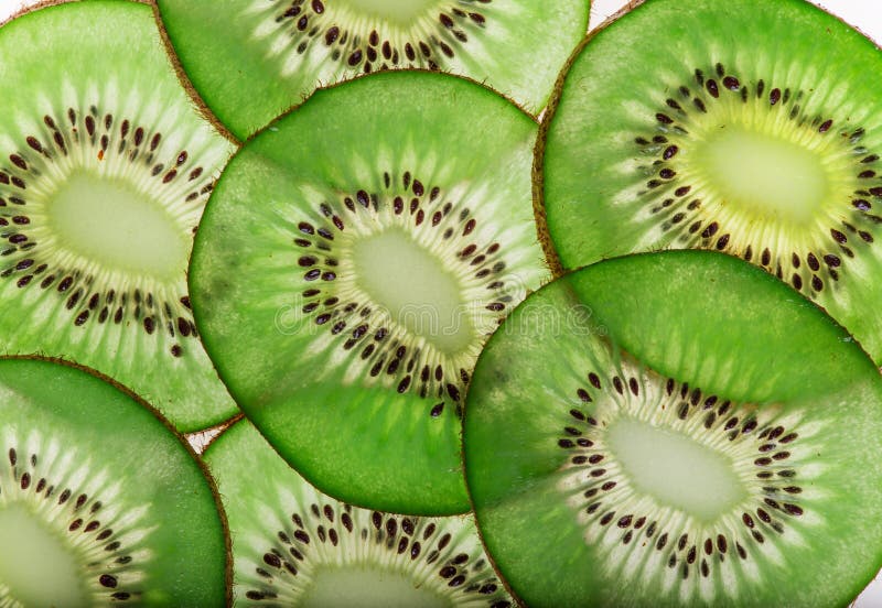 Bright fresh kiwi slices, back light transparent fruit. royalty free stock photos Bright fresh kiwi slices, back light transparent fruit. royalty free stock photos