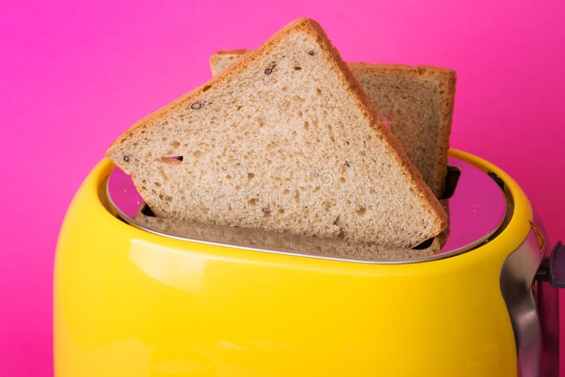 Yellow Toaster on a Pink Background Stock Photo Image of bright