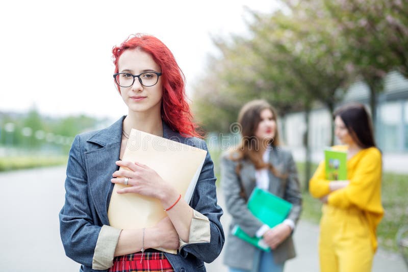 Bright girl student with a folder. Education concept, exams, friendship and group of people royalty free stock photos Bright girl student with a folder. Education concept, exams, friendship and group of people royalty free stock photos