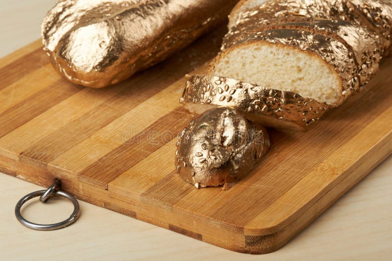 Bright gold metallic bread stock image. Image of baguette - 105869735