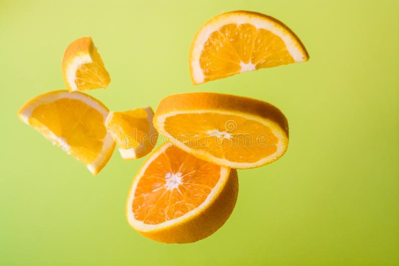 Bright Green Background, Slices of Orange are Different Sizes in Air. Vitamin  C. Healthy Nutrition. Citrus. Stock Photo - Image of ingredient,  refreshing: 170127132