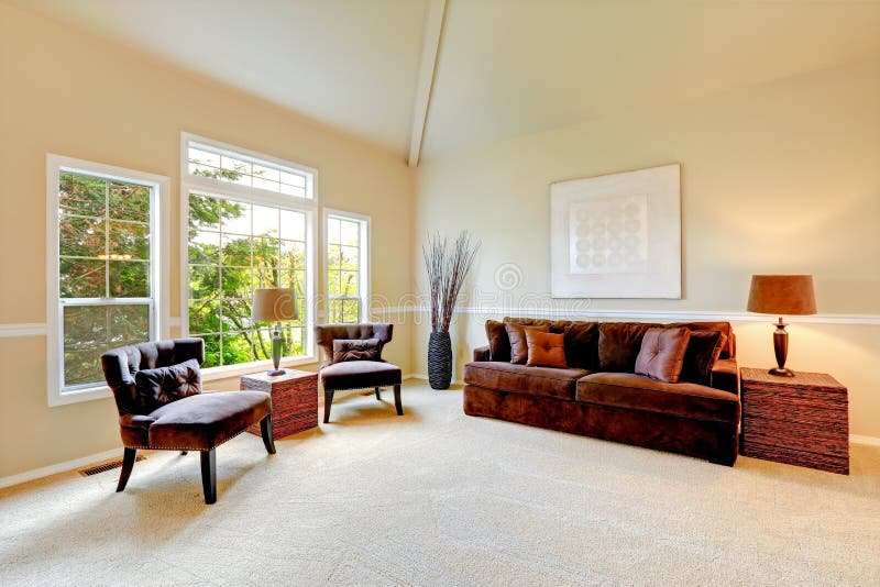 Bright ivory living room with high vaulted ceiling and french wi royalty free stock photos Bright ivory living room with high vaulted ceiling and french wi royalty free stock photos