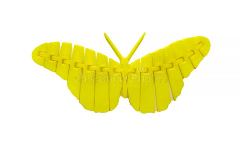 Bright light yellow object in shape of butterfly toy printed on 3d printer. Isolated on white background. Fused deposition modeling, FDM. Concept modern stock image Bright light yellow object in shape of butterfly toy printed on 3d printer. Isolated on white background. Fused deposition modeling, FDM. Concept modern stock image