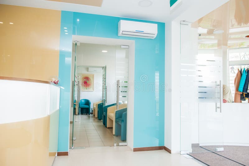 Bright modern interior of waiting hall with reception and wardrobe zones. Selective focus stock photo Bright modern interior of waiting hall with reception and wardrobe zones. Selective focus stock photo