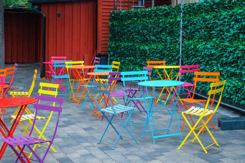 Bright Multicolored Chairs and Tables on the Terrace of an Outdoor