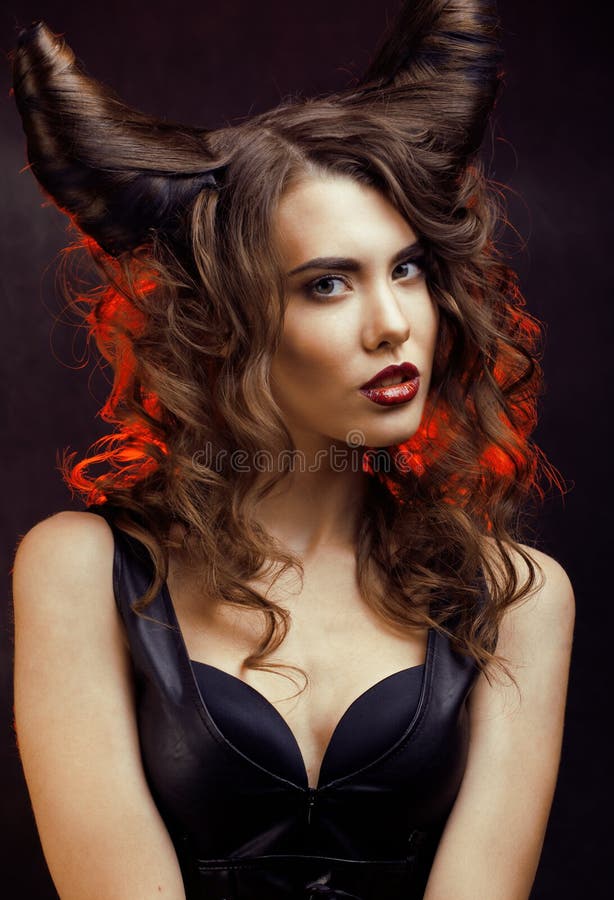 Bright mysterious woman with horn hair, halloween