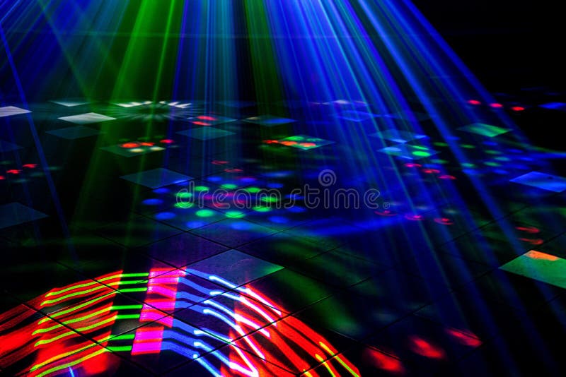 Bright nightclub red, green, purple, white, pink, blue laser lights cutting through smoke machine smoke
