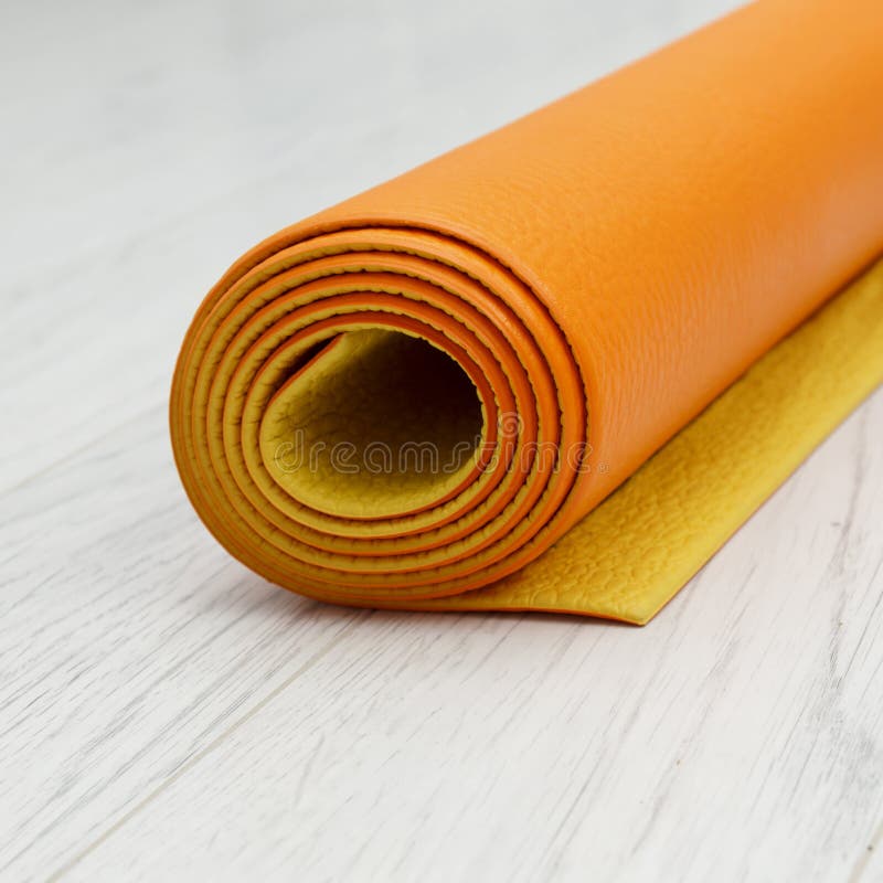 Bright Orange Yoga Mat on a Light Gray Laminate Stock Image Image of